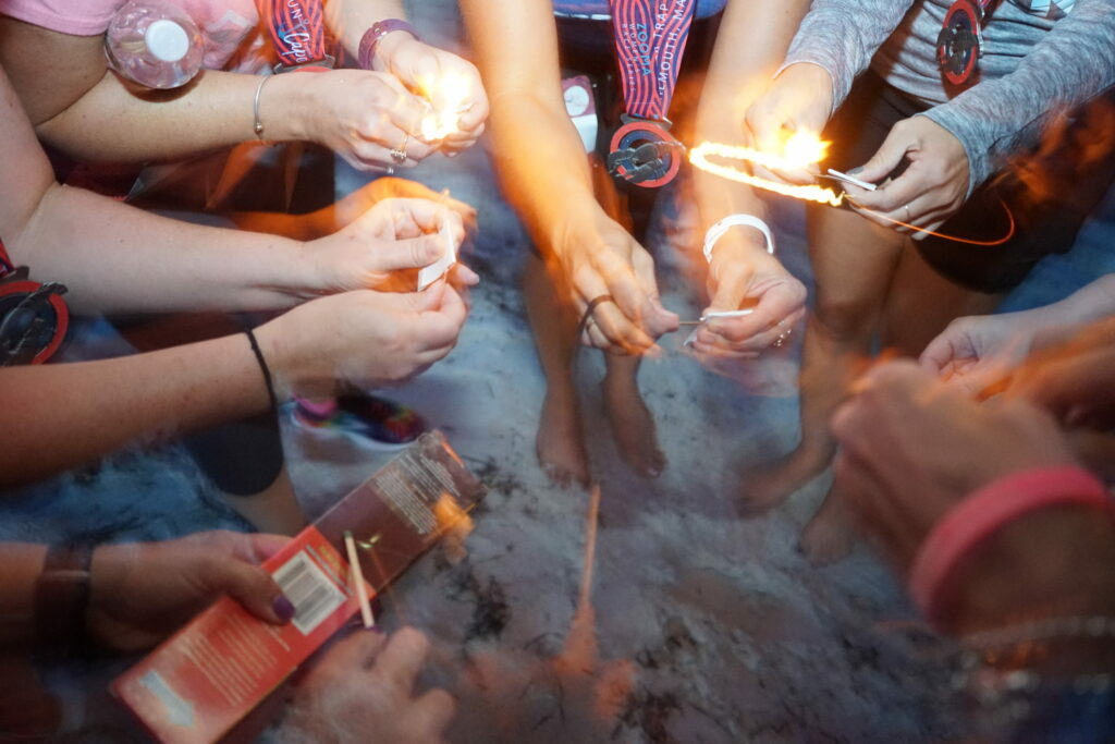 a group of people standing around each other