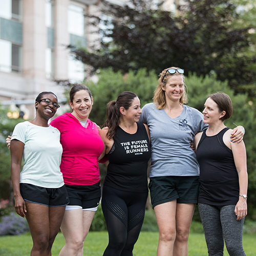 a group of women standing next to each other